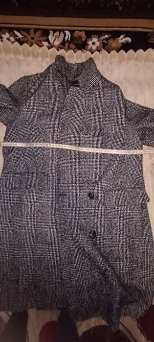 Жіноче пальто сірого кольору