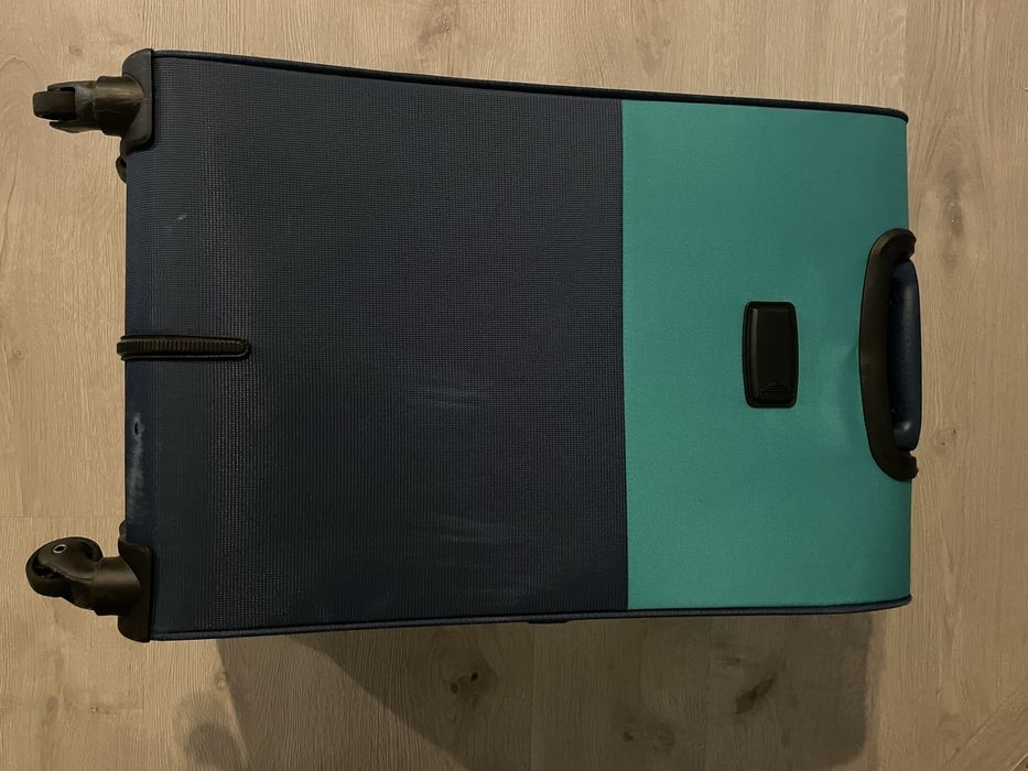 Mala de viagem de marca Pack it com a cor azul/verde a
