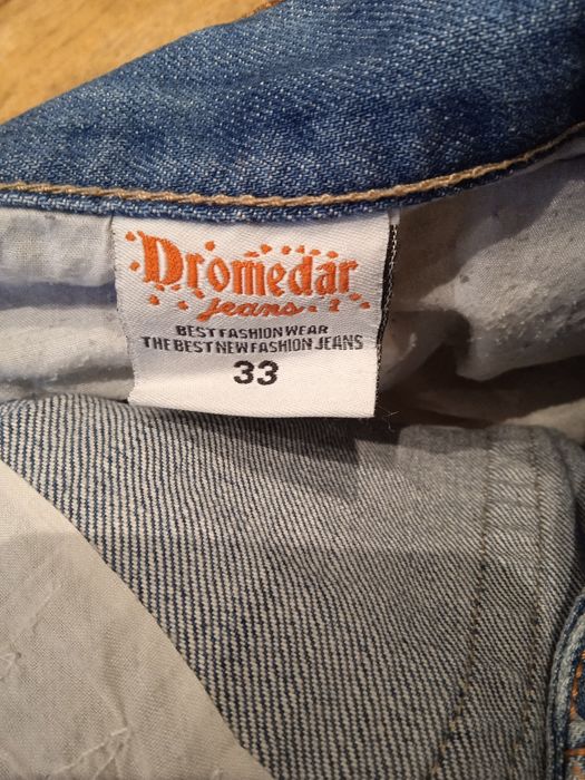 Jeansy z przetarciami 33