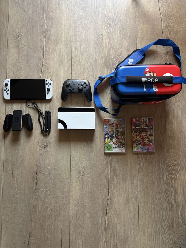 Nintendo switch oled + 2 gry mario kart i supersmash bros +akcesoria