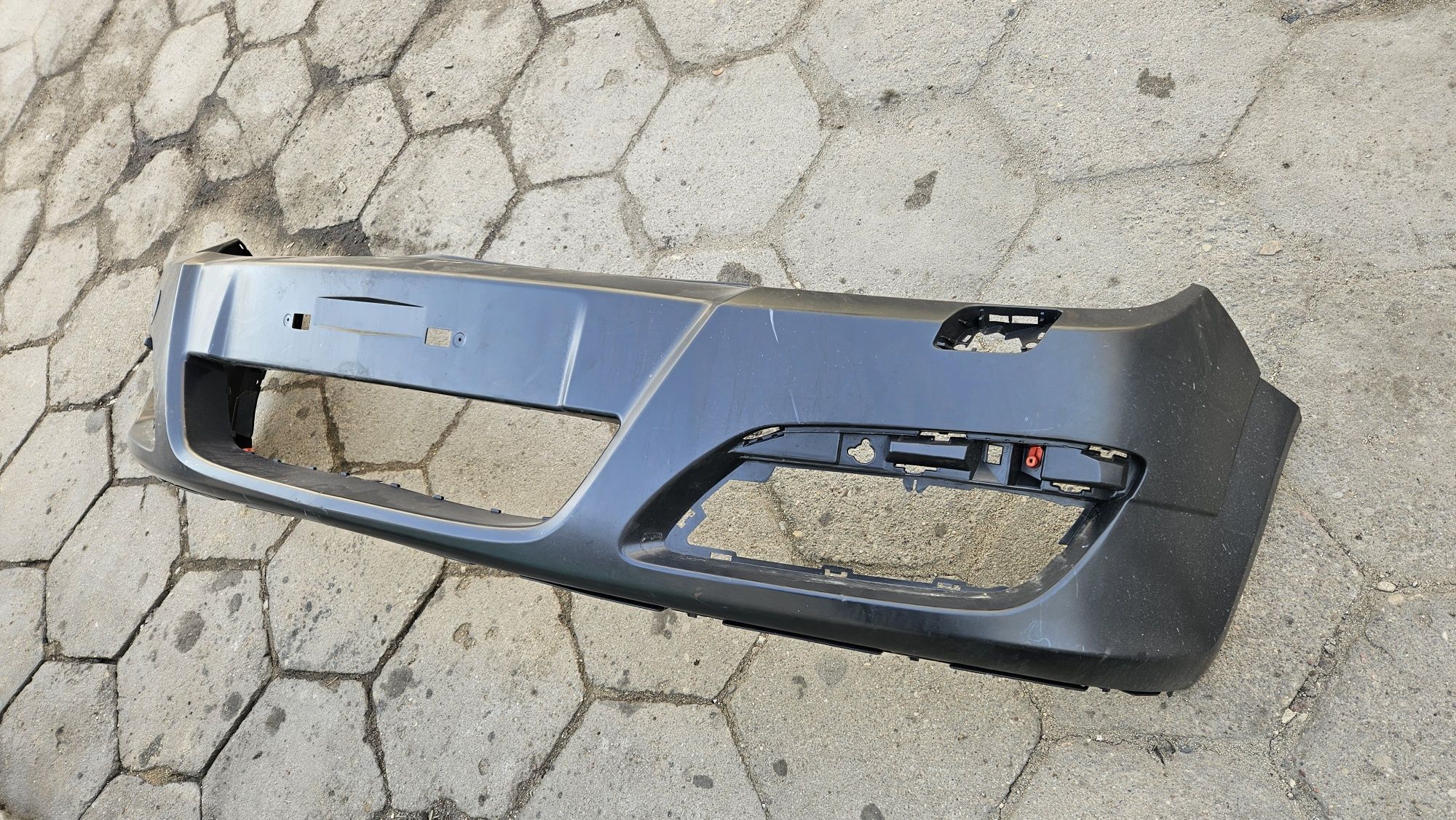 Nowy zderzak przód przedni opel astra h pod spryskiwacze reflektorów
