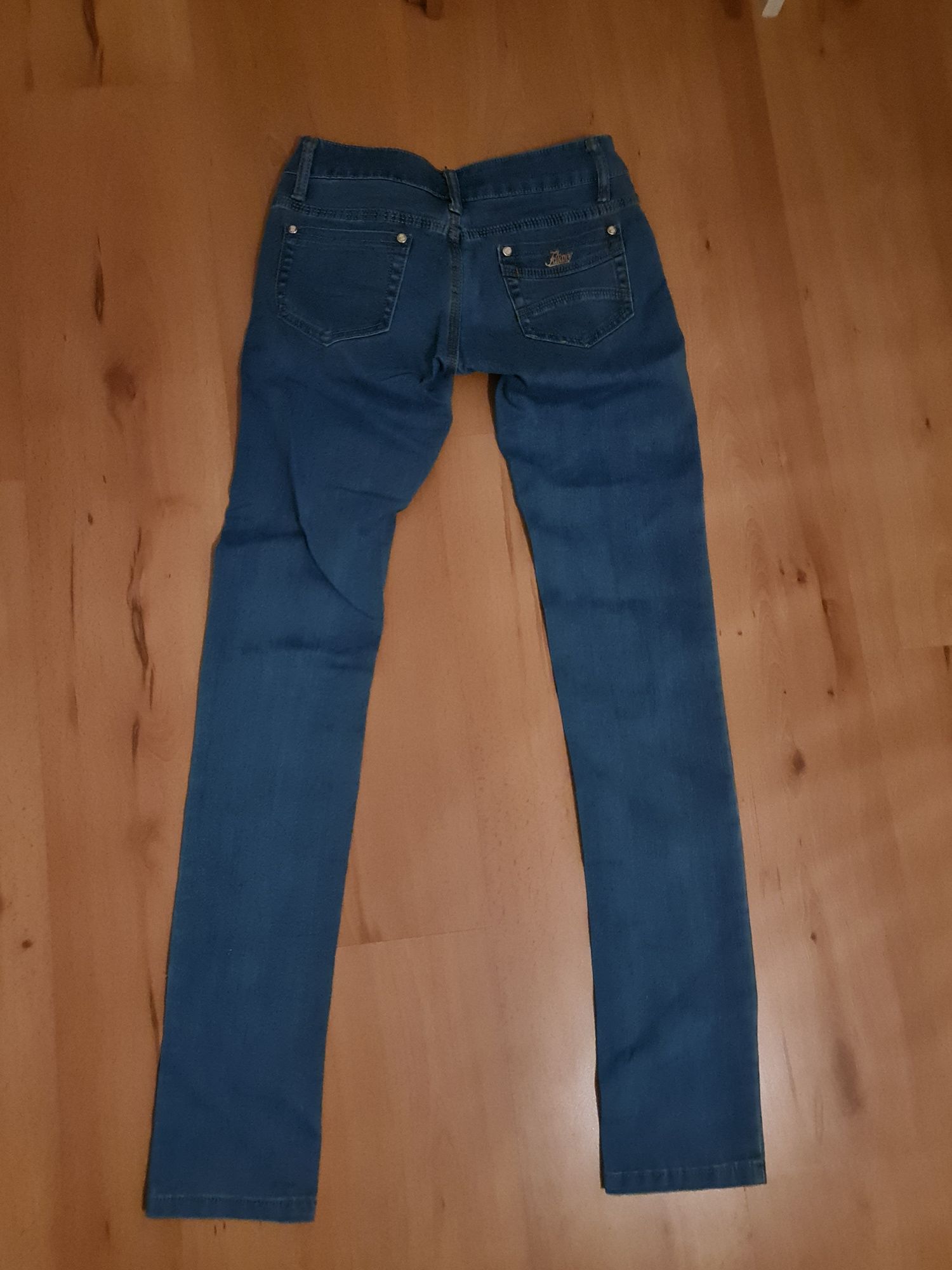 Spodnie damskie jeans rozmiar 25 S niebieski