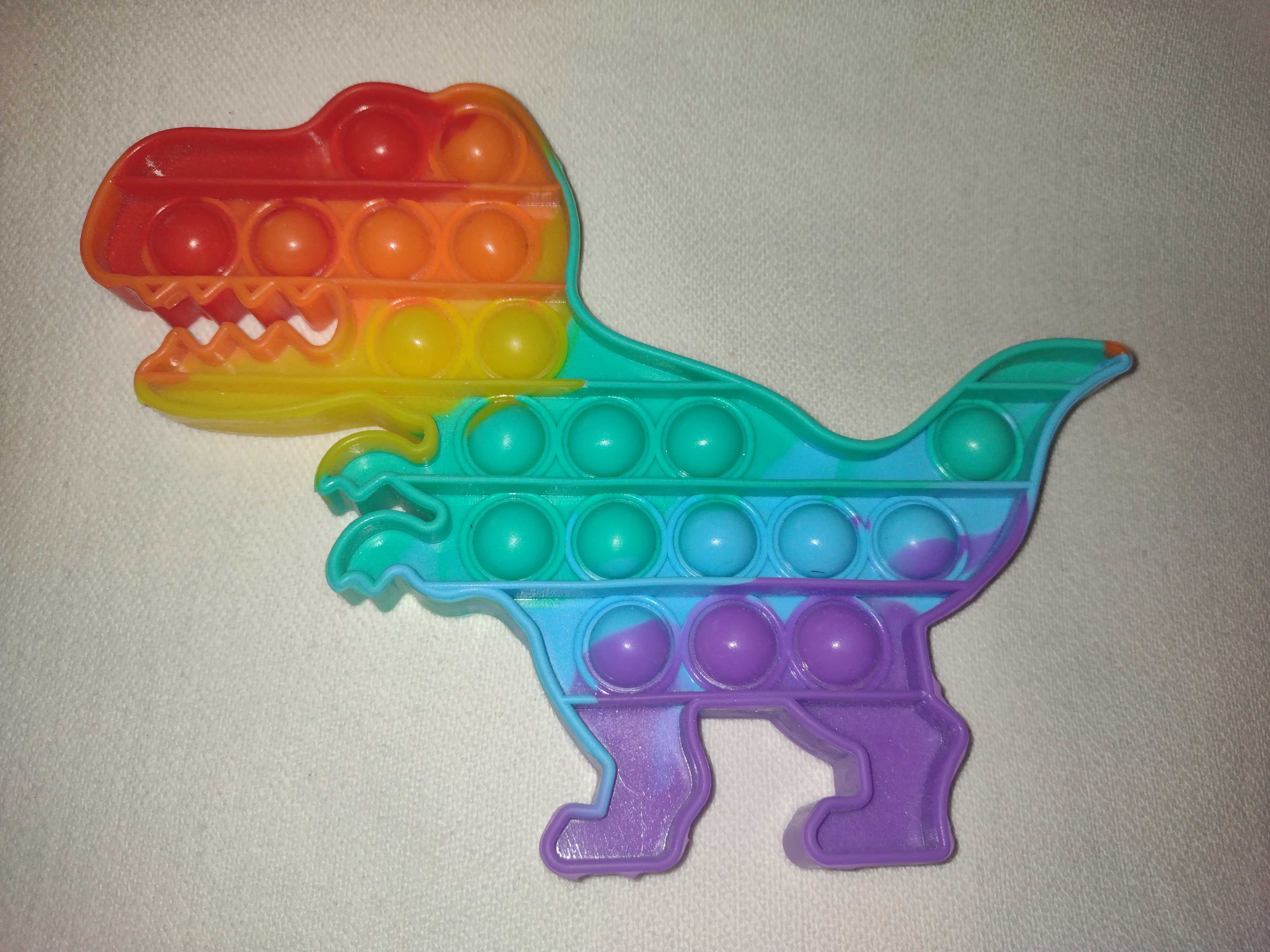 zabawka SENSORYCZNA PUSH BUBBLE POP IT. Dinozaur. Stan idealny