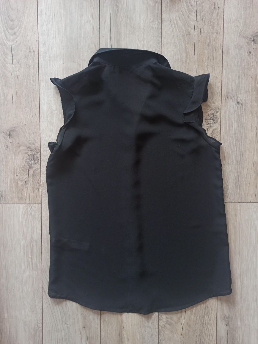Elegancka czarna bluzka basic bez rękawów - Calliope