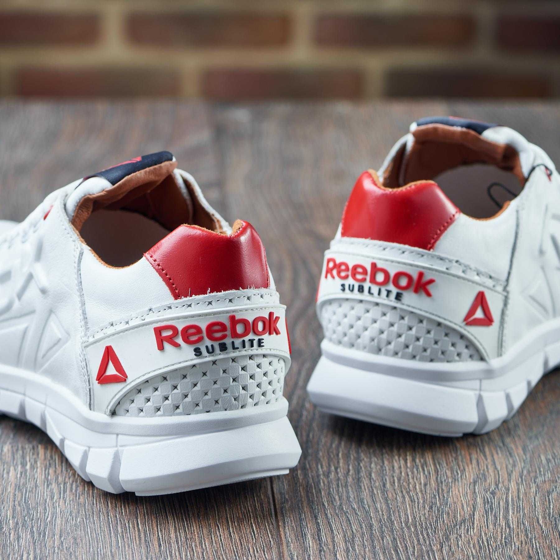 Сеть обувных магазинов предлагает Чоловічі білі кросівки шкіра  Reebok