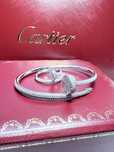 Золотий браслет та каблучка з діамантами у стилі Cartier