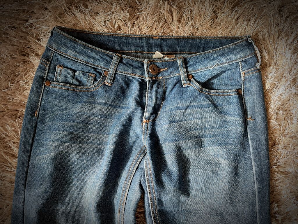Jeansy damskie Mango