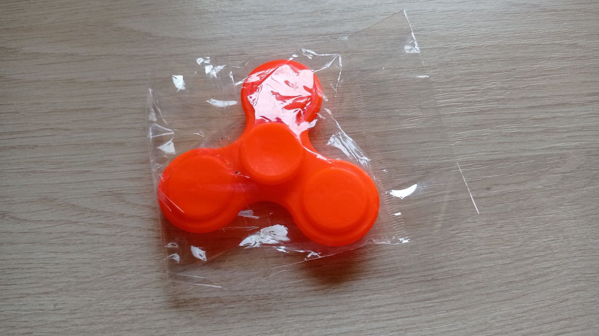 Fidget spinner spiner - nowy w folii, nieużywany - kol.jaskrawy orange