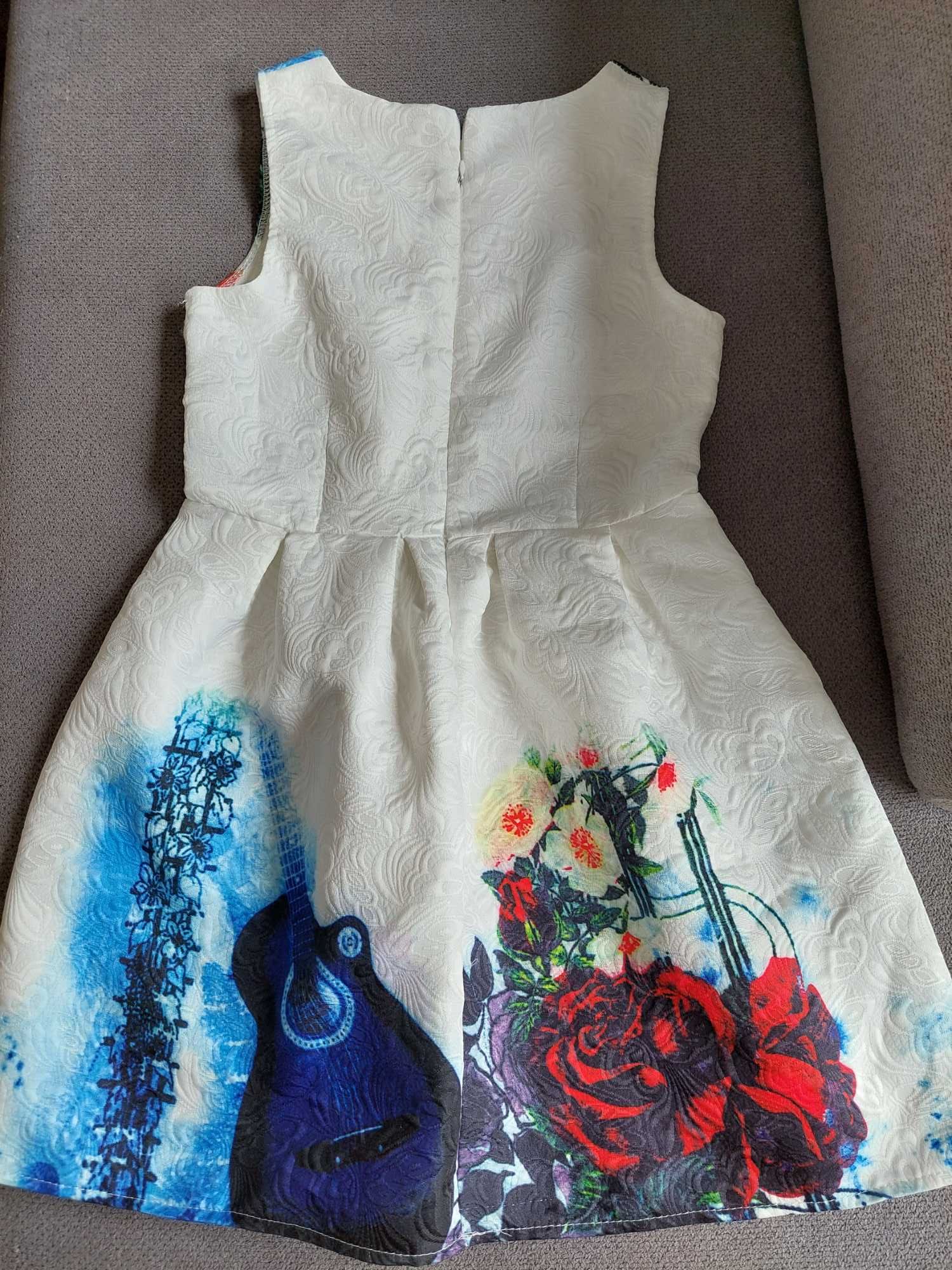 Sukienka elegancka roz. 164 bdb+. Wzór z gitarą i różami.