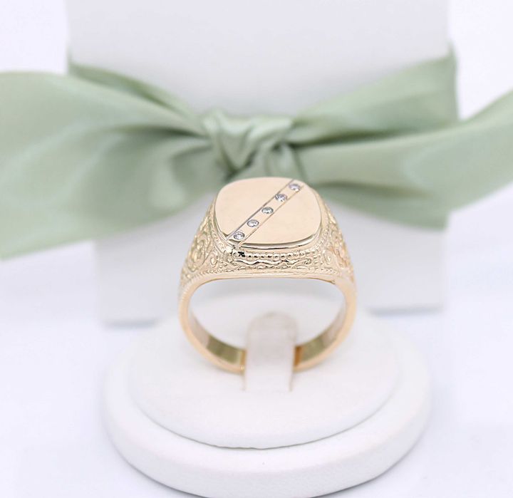 Złoty sygnet p.585/15,38g z brylantami