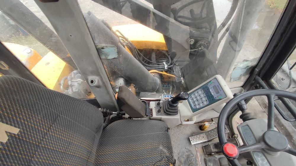 Koparko-ładowarka Mecalac 12MTX. Rok produkcji 2012. Komplet łyżek