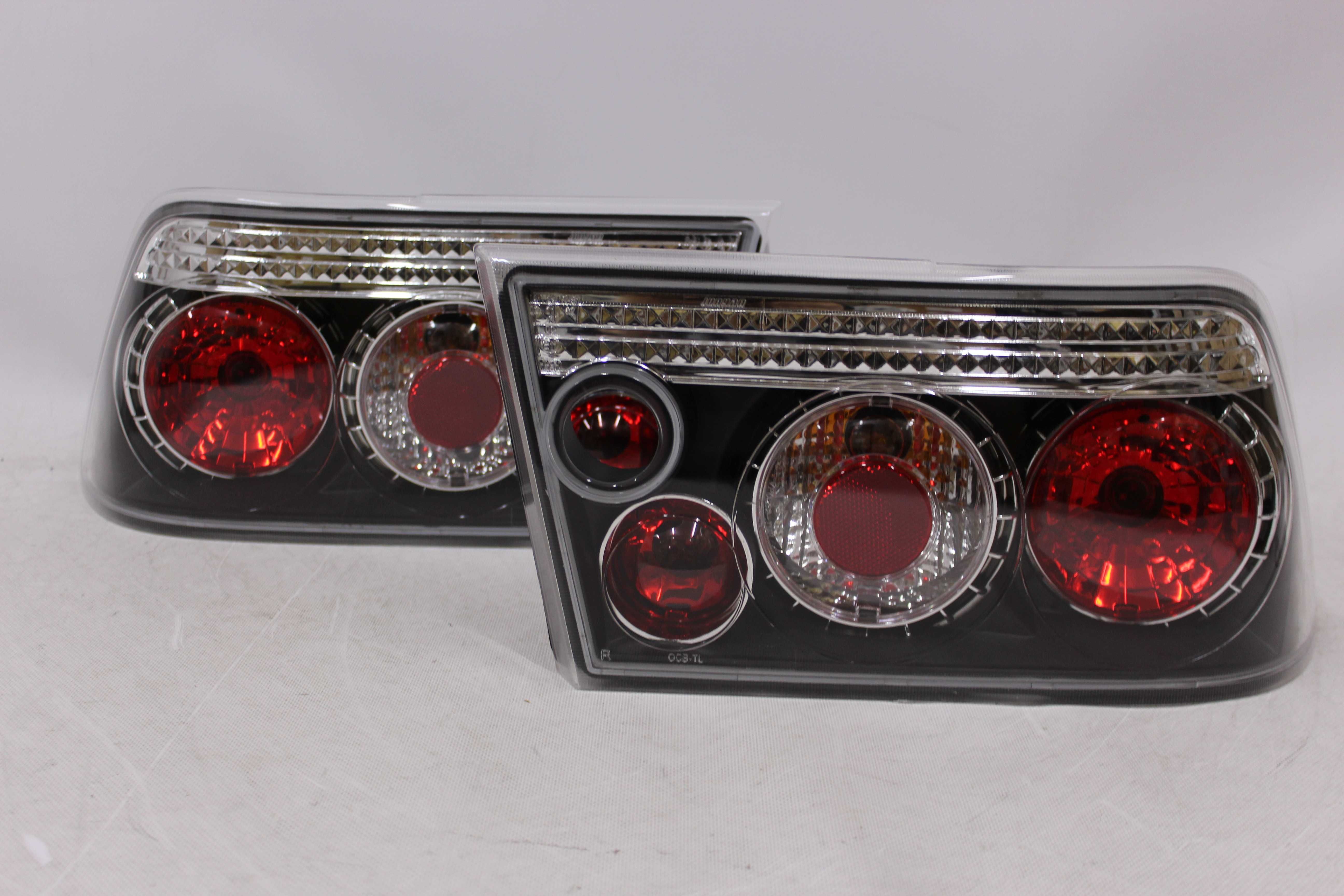 Lampy światła tył tylne OPEL CALIBRA 90-97 BLACK Czarne Smoke NOWE