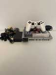 Konsola PlayStation 2 Slim, srebrna, z grami
