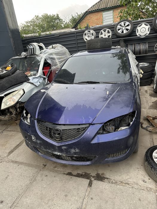 Двери мазда три  в нормальном состоянии