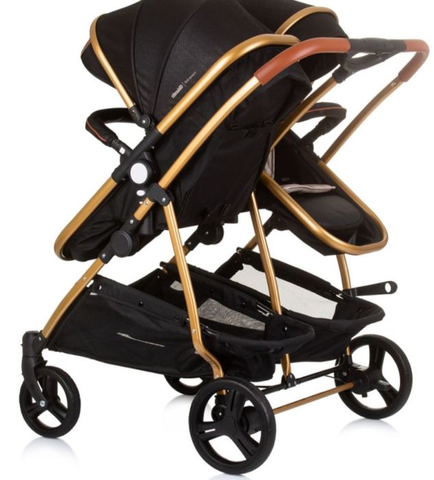 Carrinho de gemeos bebé chipolino preto com detalhes em dourado