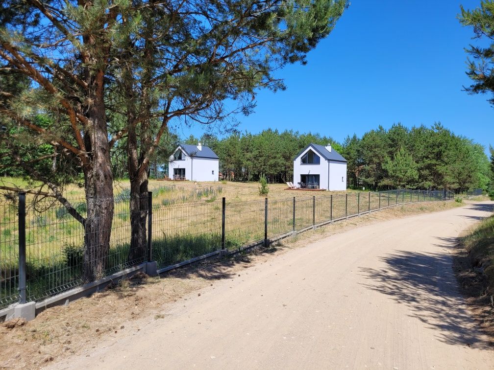 Domki Ryn Mikołajki Mazury jezioro i las