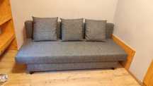 Rozkładana sofa szara Asarum IKEA kanapa z funkcją spania i schowkiem