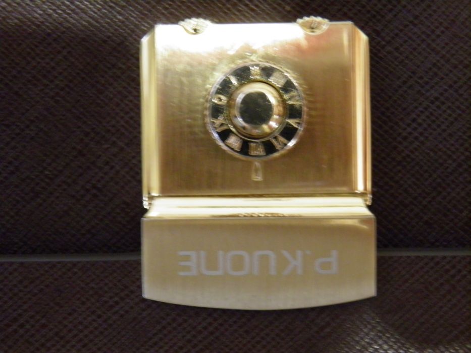 Барсетка - P.KUONE из воловьей кожи.