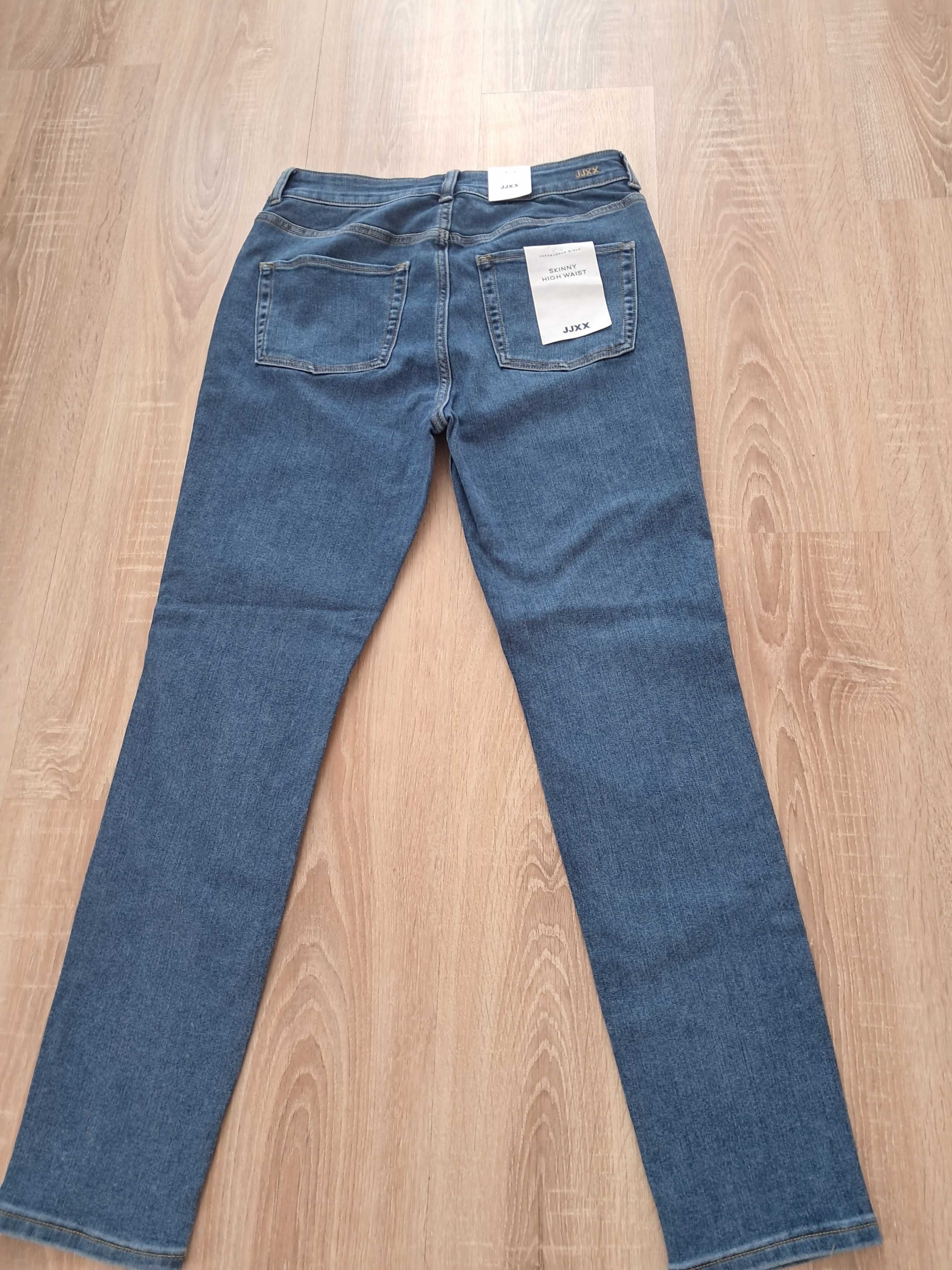 Spodnie jeansowe  Nowe z Metką.80cm pas