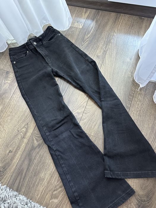 Джинси чорні кльош