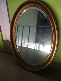 Espelho oval moldura em talha dourada