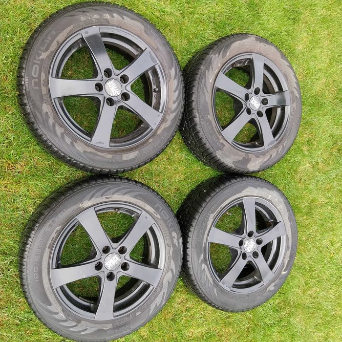 Koła zimowe 5x100 185/60/15 alufelgi czarne Dezent opon Nokian VW polo