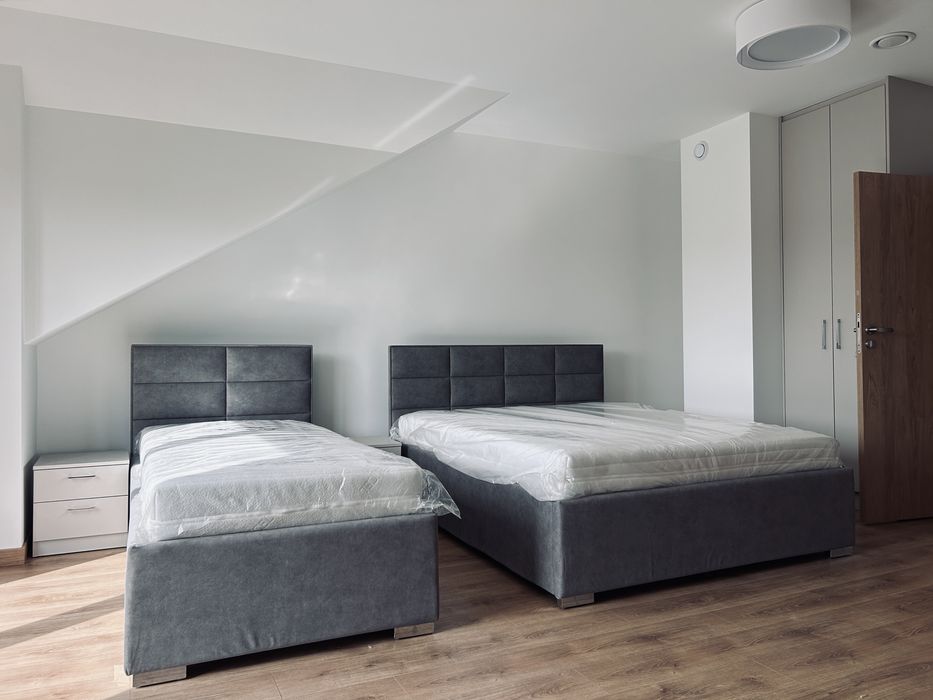 Łóżka tapicerowane na wymiar – solidne, eleganckie, nowoczesne