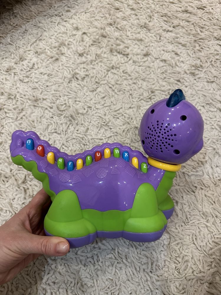 Муична інтерактивна іграшка динозавр англійський алфавіт