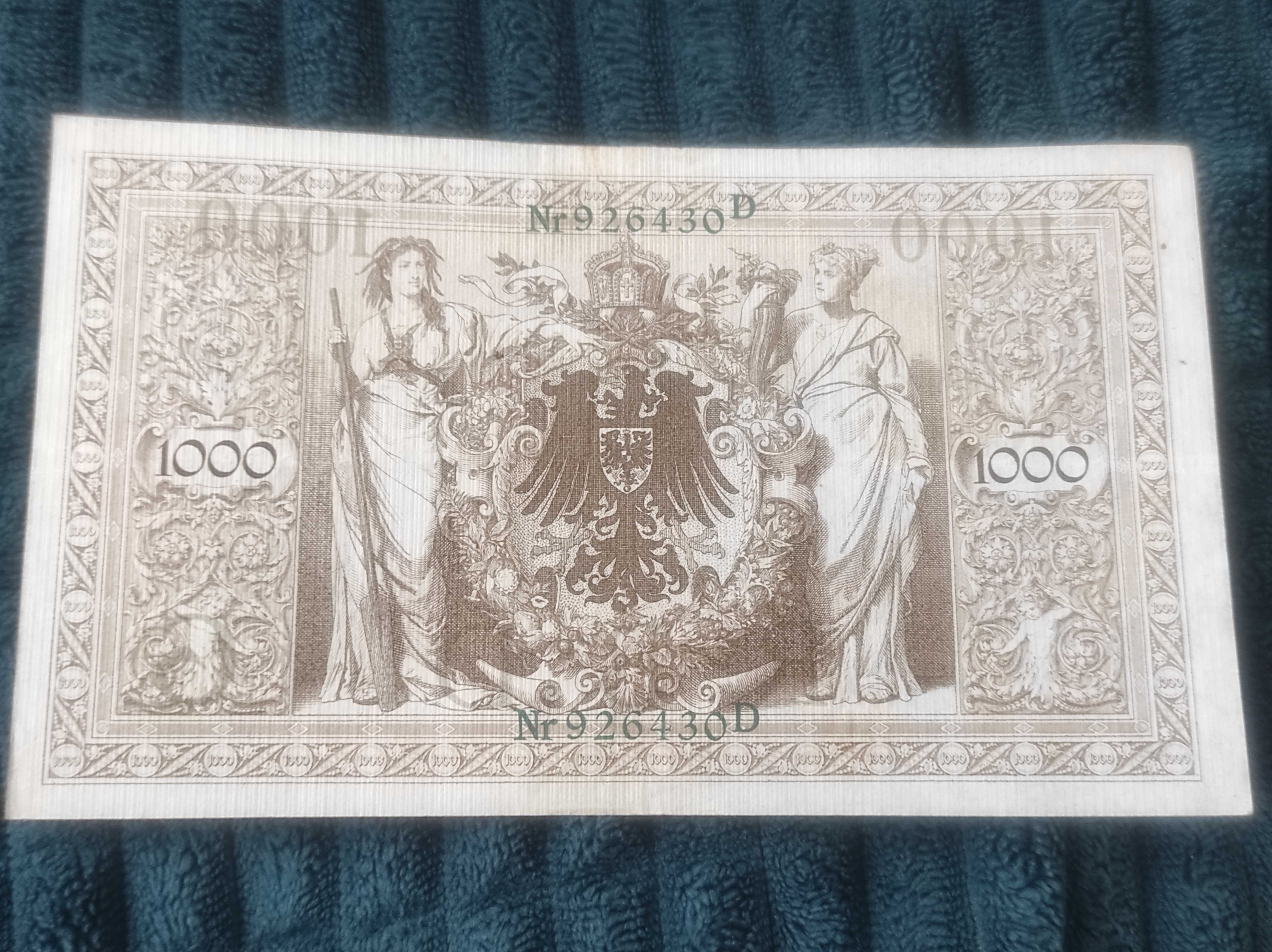 Banknot Niemcy 1000 Marek 1910 z zielonym numerem i pieczęcią.