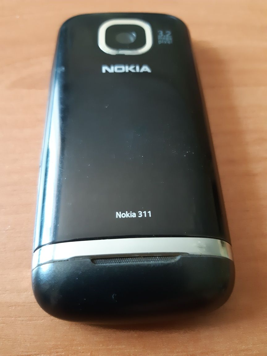 Nokia 311 мобильный телефон б/у, в рабочем состоянии.