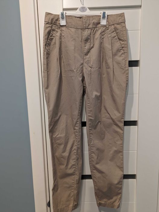 Бежеві штани з защіпами