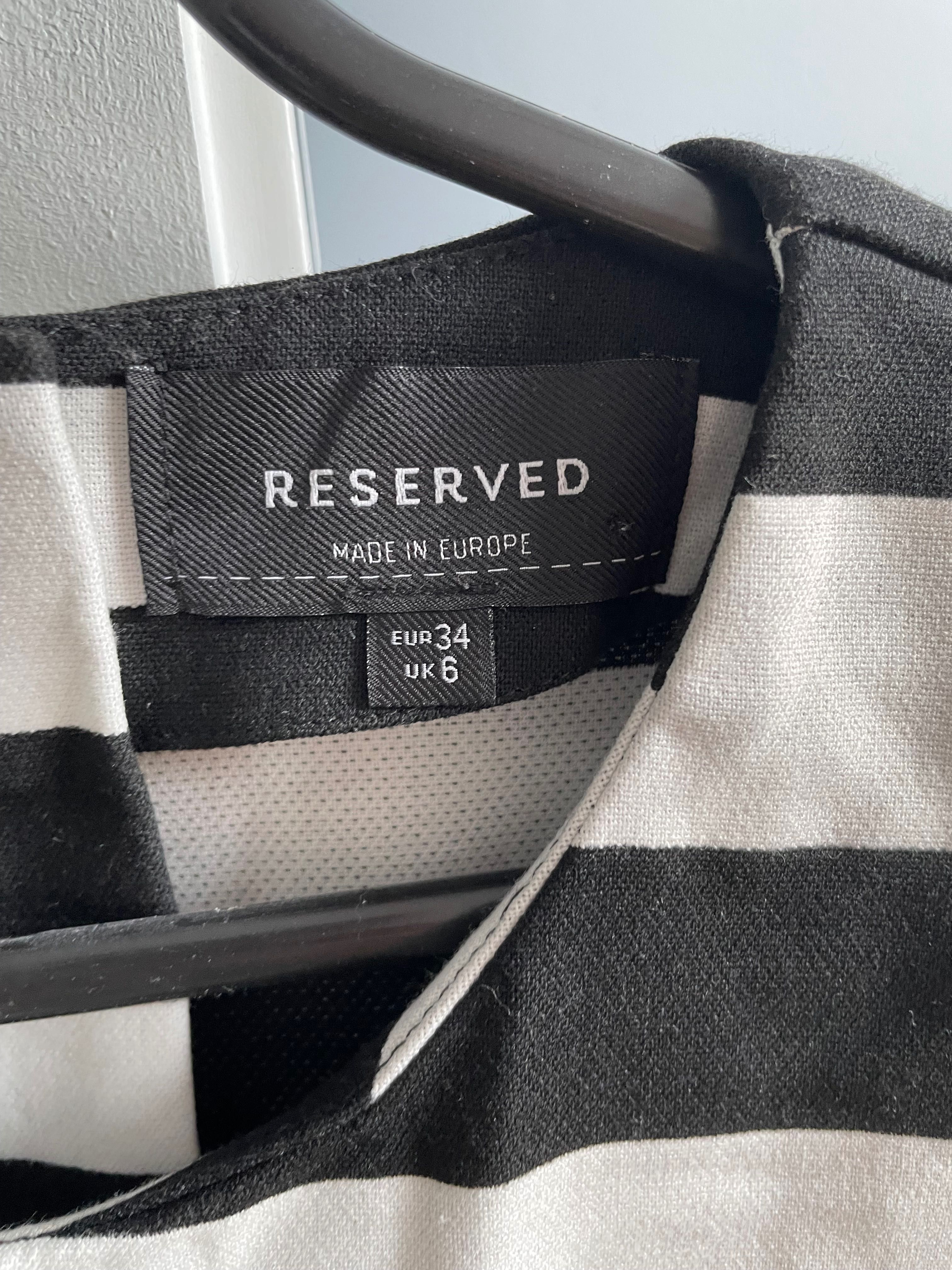 Damska bluzka z baskinką Reserved