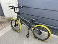 Rower BMX BTWIN Wipe 500 – koła 20” – zielony z żółtymi oponami