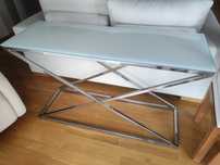 Mesa de vidro e prateado