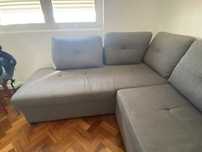 Sofá-cama de cor cinzenta