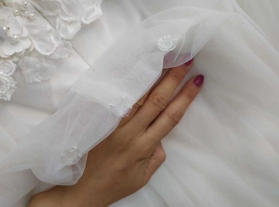 Suknia ślubna Daniela Di Marino z trenem