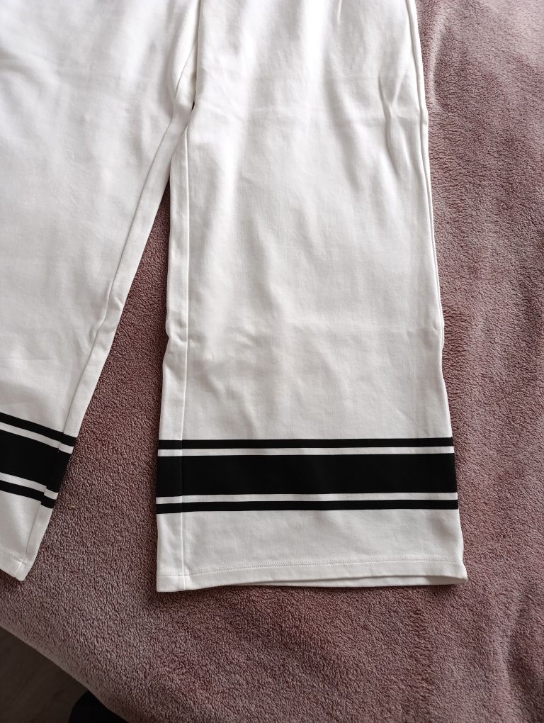 Reserved rozmiar L/XL 40/42 białe spodnie dresowe szerokie