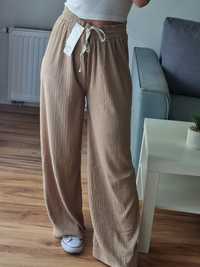 Nowe letnie bawełniane beżowe spodnie z szerokimi nogawkami r. L/XL