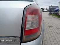 OPEL ASTRA H LAMPA TYLNA PRAWA W BŁOTNIK KOMBI