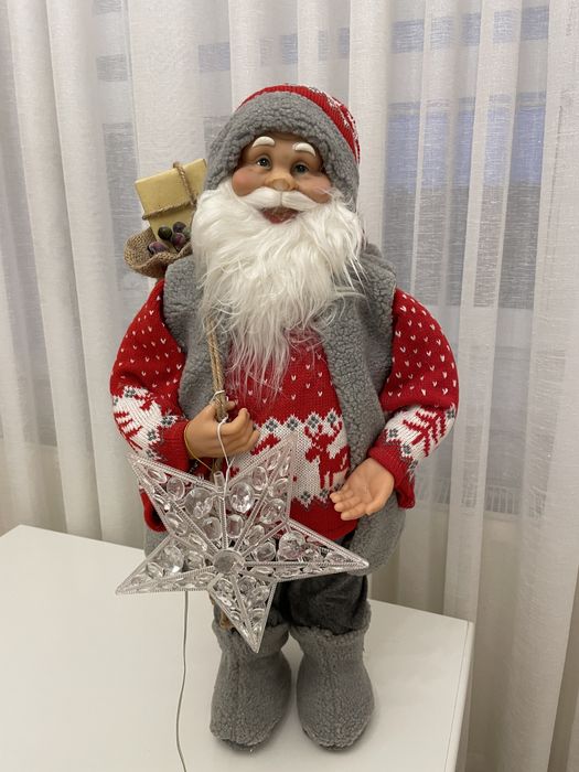 Ozdobny św. Mikołaj na Boże Narodzenie Eurofirany z świwcącą gwiazdą