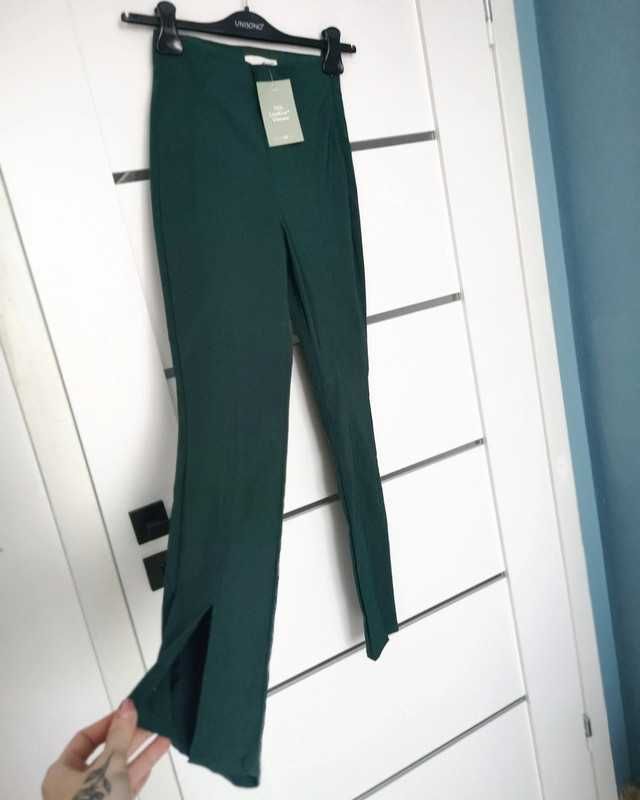 Spodnie wysoki stan, elastyczne dopasowane, rozcięte nogawki H&M XS