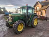John Deere 6200 rewers przy kierownicy