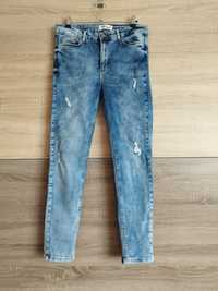 Koton marmurkowe jeansy z przetarciami W31