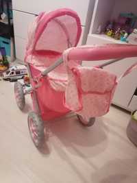 Wózek dla lalki z małą lalą