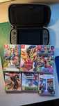 Nintendo Switch + gry (Mario Kart 8, Smash Bros., Pokemon Shield itp.)