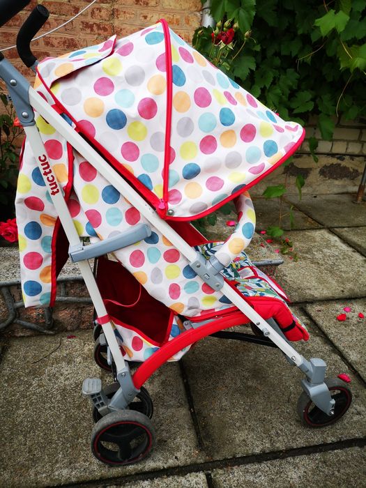 Яскрава коляска тростина Tuc Tuc (Іспанія) в горох.