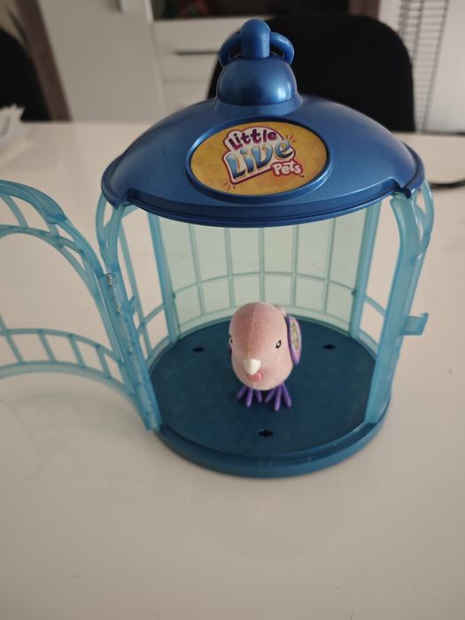 Brinquedo pássaro com gaiola