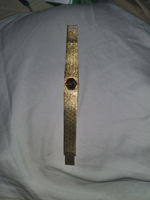 Relógio mecânico com banho de ouro