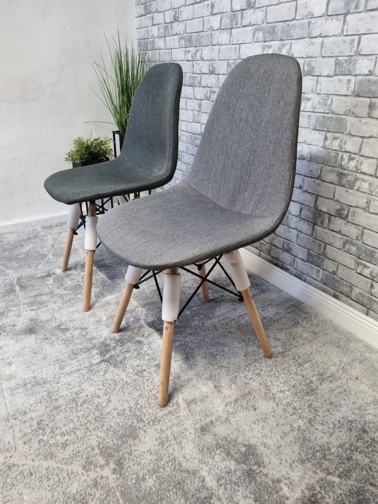Nowe krzesła skandynawskie szary materiał.