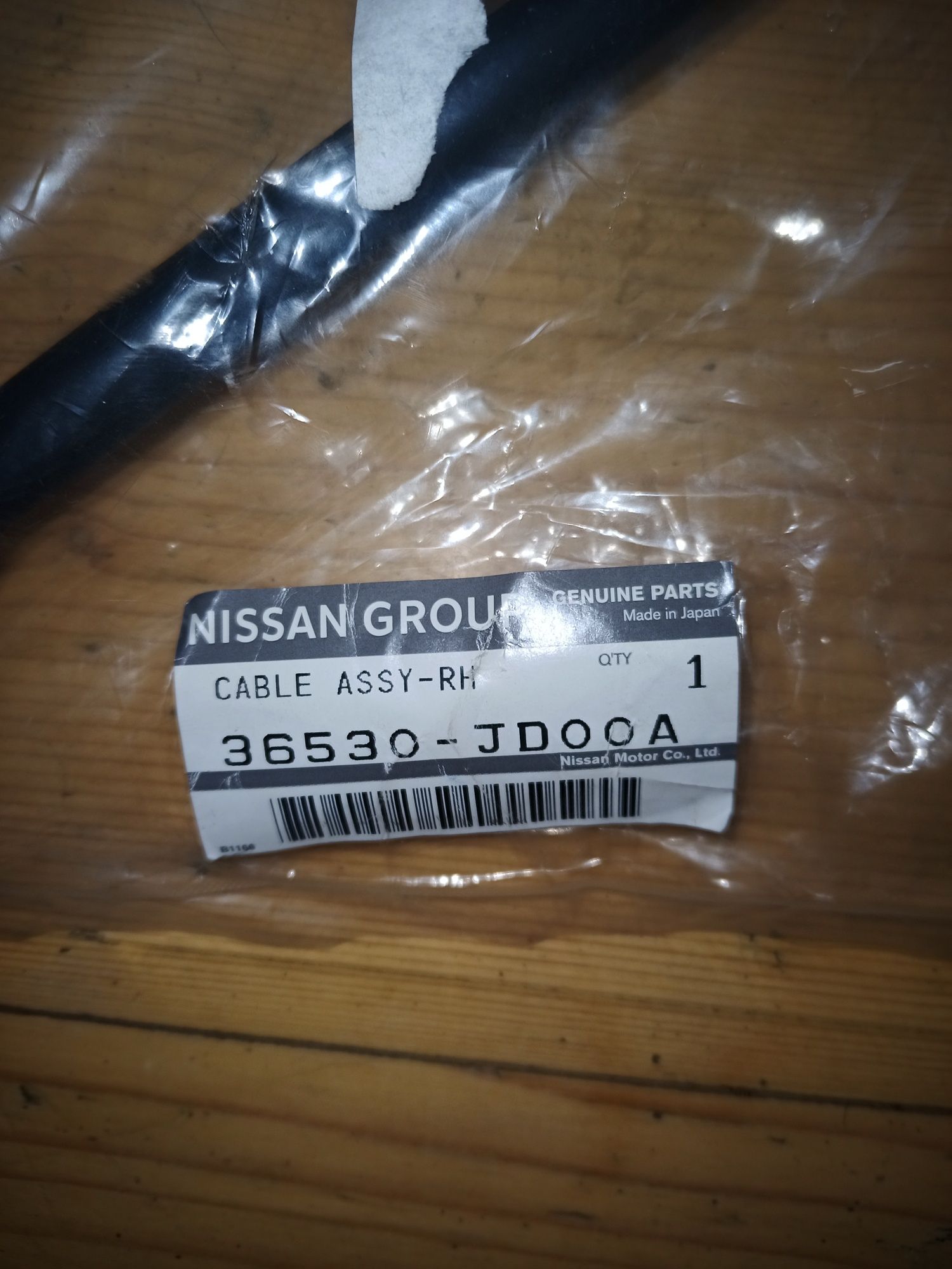 Трос ручного тормоза правый Nissan 36530JD00A